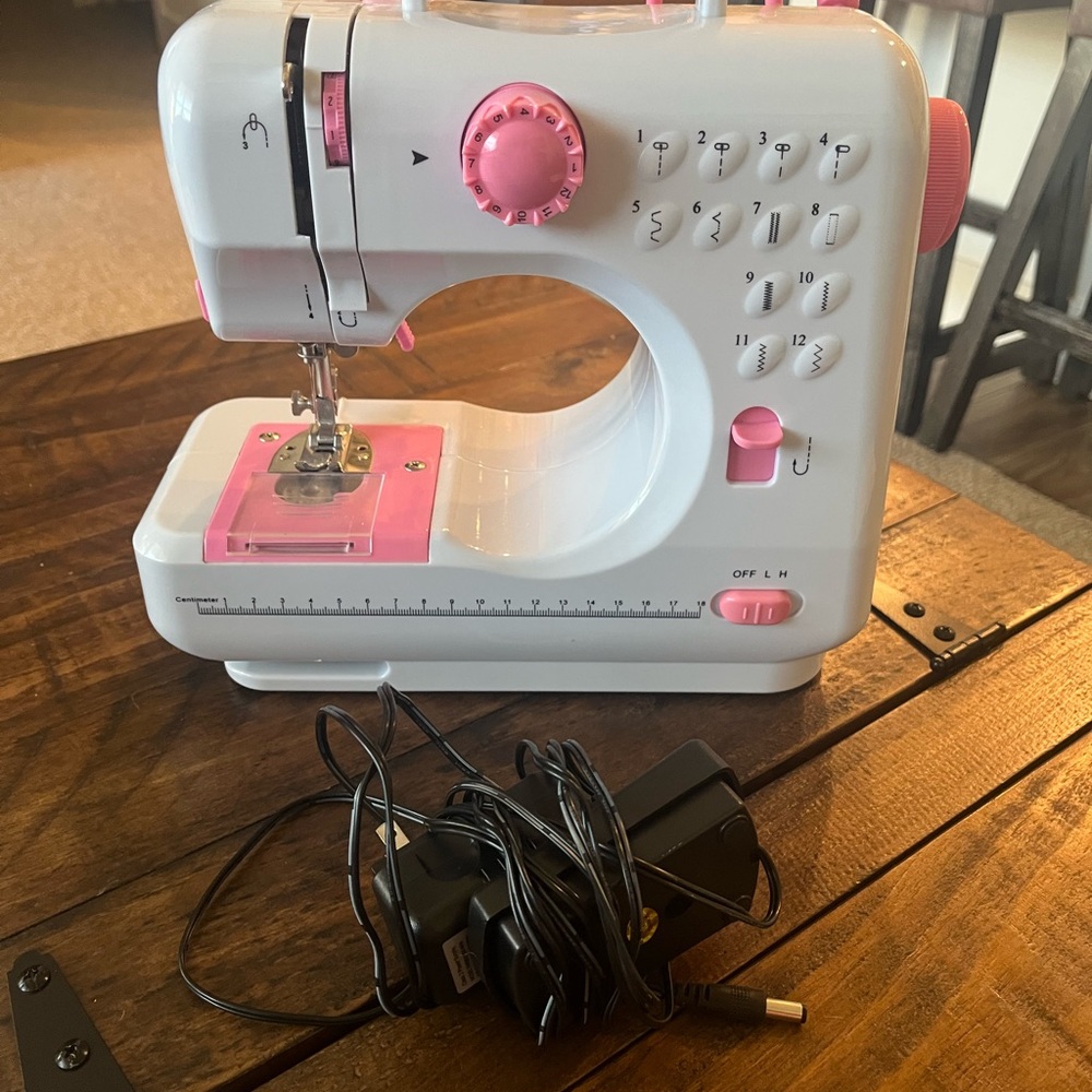 Compact White and Pink Sewing Machine